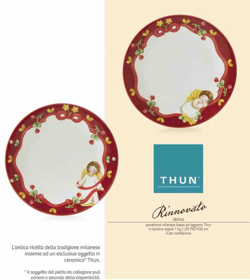 IMMAGINE PIATTO THUN CONTENUTO NELLA PROPOSTA PIATTO PANETTONE THUN. PIATTO CON BORZO ROSSO NATALIZIO CON ANGIOLETTO FISCHIETTANTE E FIORELLINI GIALLI E VERDI SUL BORDO ROSSO. INTERNO PIATTO BIANCO. UNA VERSIONE PRESENTA UN ANGIOLETTO CHE DORME.